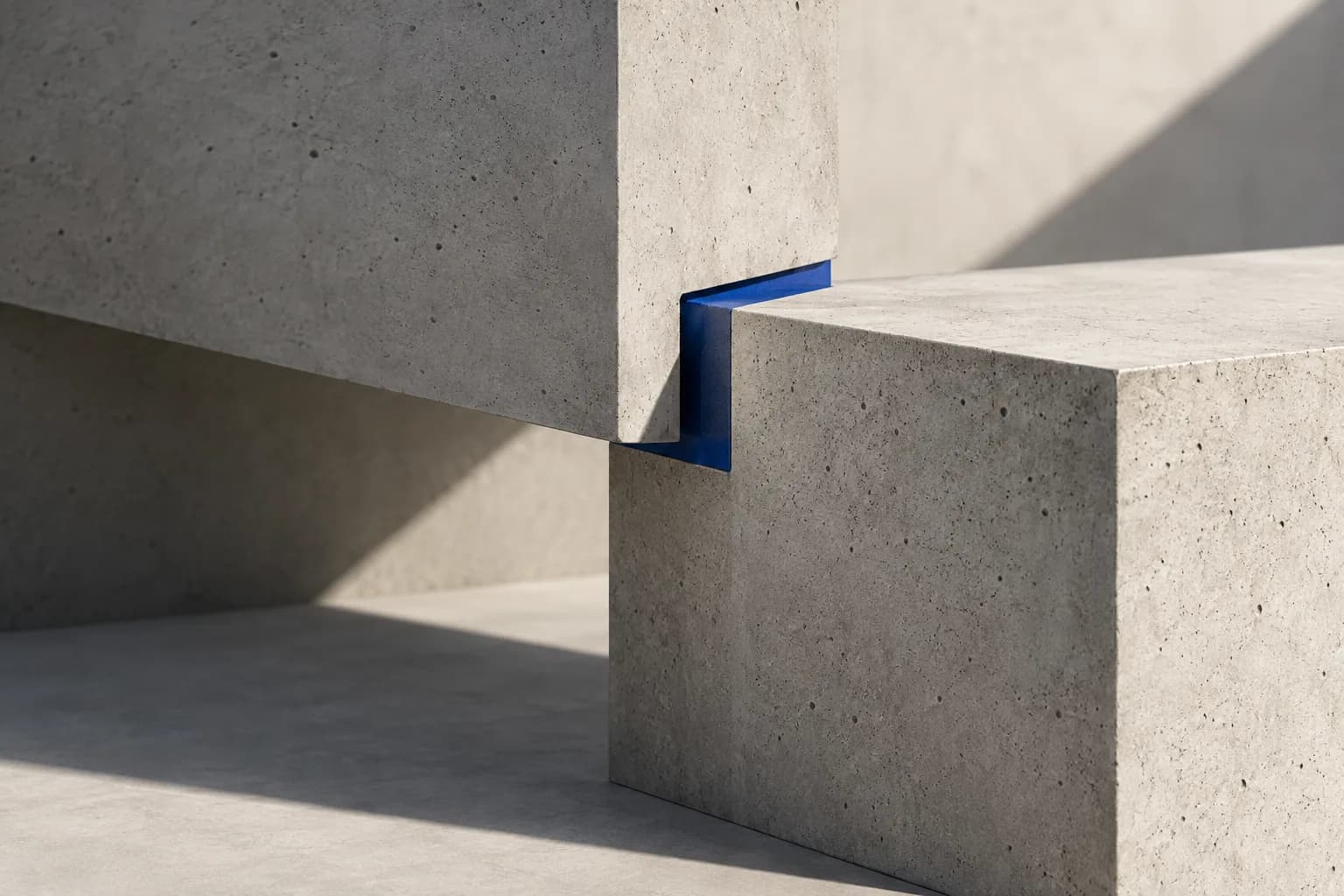 Interlocking architectural forms joined by a precise blue connection